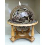 A modern printed wooden armillary sphere,