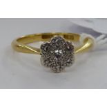 An 'antique' 18ct gold ring, set with seven small diamonds,