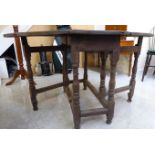 A late 18th/early 19thC country made oak gateleg table with an oval top, over an end drawer,