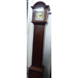 A mid 20thC mahogany cased grandmother clock, the hood with an arched top, over a straight trunk,