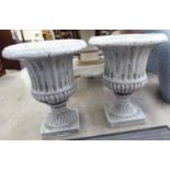 A pair of modern Italianate cream coloured crackle glazed campana design pedestal terrace vases