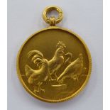 A 9ct gold medallion,