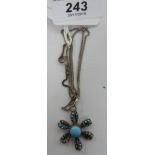 A silver petal design pendant necklace,