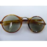 A pair of 'antique' simulated tortoiseshell framed folding spectacles with 9ct gold mounts cased