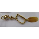 An 18ct gold and gold plated key chain 11