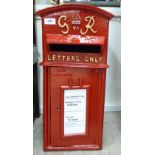 A modern reproduction of a red painted post box with a hinged door 23''h 11''w CS