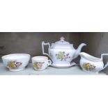 New Hall porcelain tea ware, comprising a teapot of elongated octagonal form,