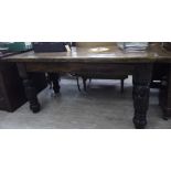 A 20thC reproduction of a Jacobean oak dining table with a planked top, raised on profusely carved,