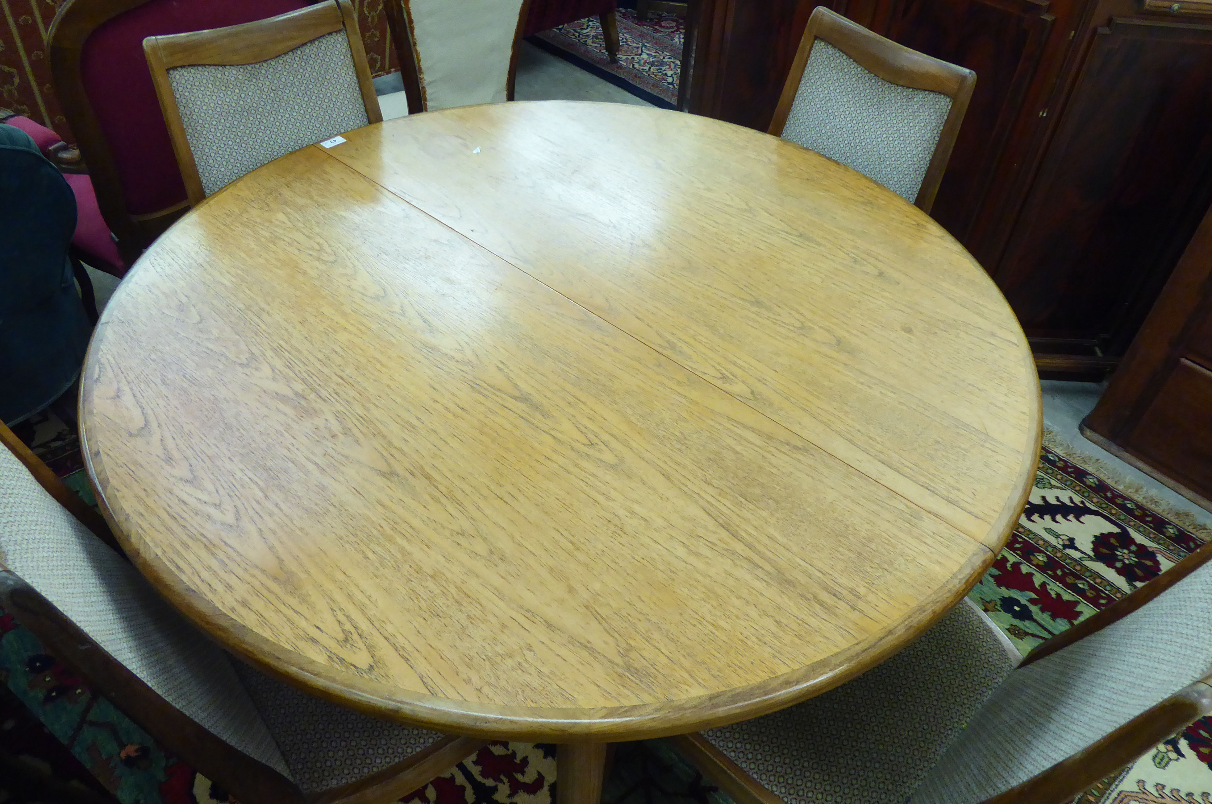 A modern G-Plan teak dining table, the two part D-end top incorporating a concealed folding leaf, - Image 2 of 2