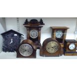 Six clocks: to include an early 20thC Black Forest carved softwood cuckoo clock 12''h T0S8