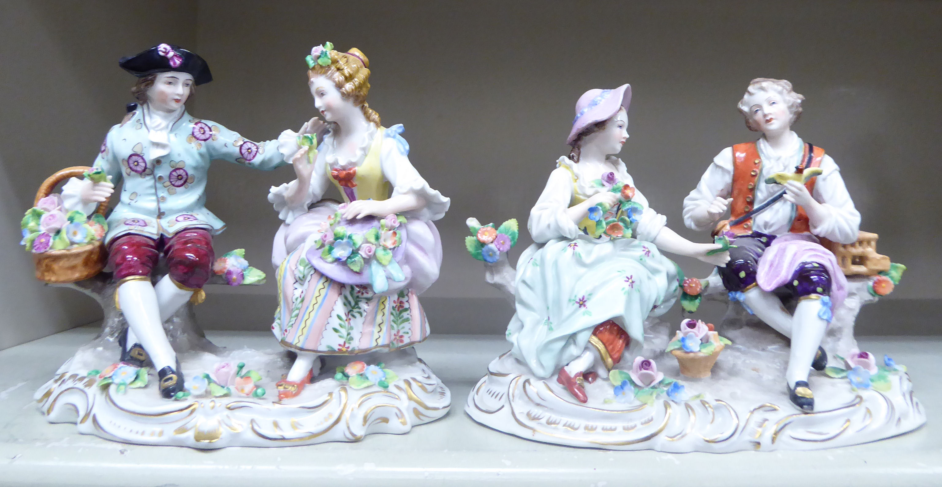 Two similar early 20thC Sitzendorf porcelain groups, each a seated courting couple 5.