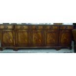 A modern Georgian style crossbanded mahogany breakfront sideboard with five frieze drawers,