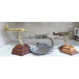 Three similar 20thC cast metal desktop model aeroplanes largest 7''h OS1