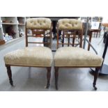 A pair of Edwardian rosewood framed nursing chairs with satinwood string inlaid and marquetry