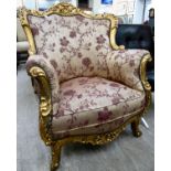 A modern Continental 19thC style gilded and carved, showwood framed, round back chair with enclosed,
