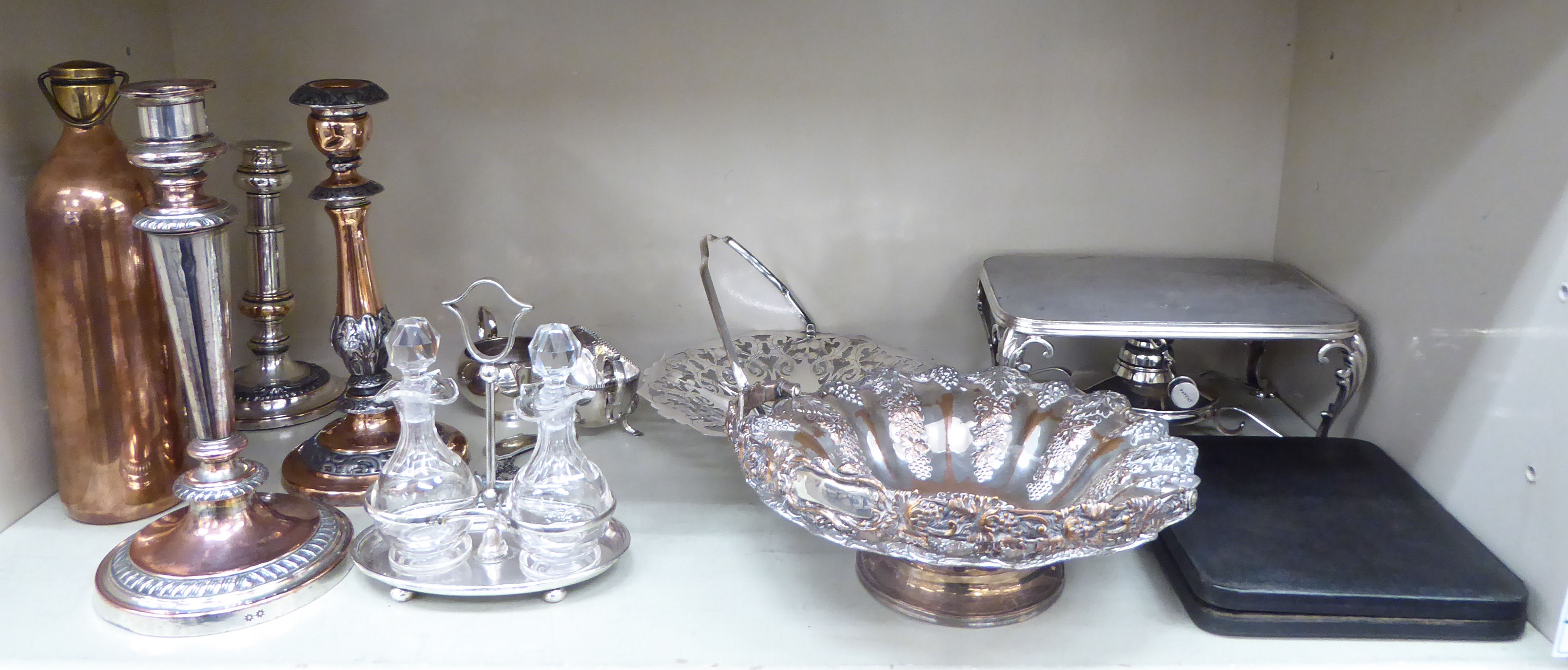 Silver plated table and other metalware: to include an oil cruet with two cut glass decanters,