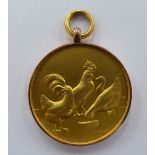 A 9ct gold medallion,