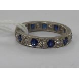 A white metal diamond and sapphire set eternity ring 11