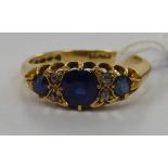 An 18ct gold claw set sapphire and diamond ring 11