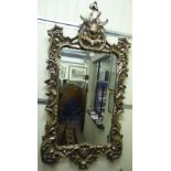 A modern reproduction of a 19thC Continental bevelled mirror,