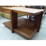 A modern teak coffee table, raised on outset plank supports,