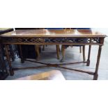 A modern Chippendale inspired mahogany centre table, the narrow, rectangular top with a satinwood,