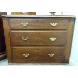 An early 20thC mahogany three drawer chest with lacquered brass bail handles,