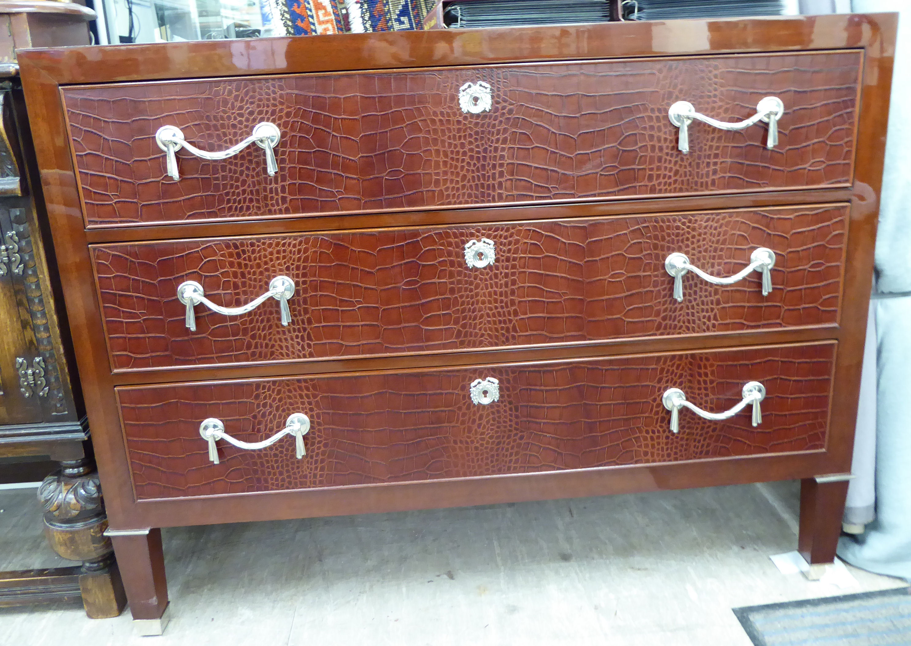 A Ralph Lauren mahogany finished sideboard with three long drawers,