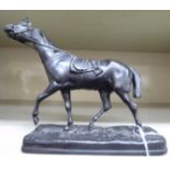 A mid 20thC spelter model, a trotting horse,