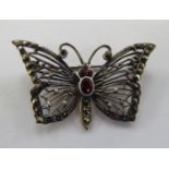 A silver marcasite and red stone set butterfly brooch 11