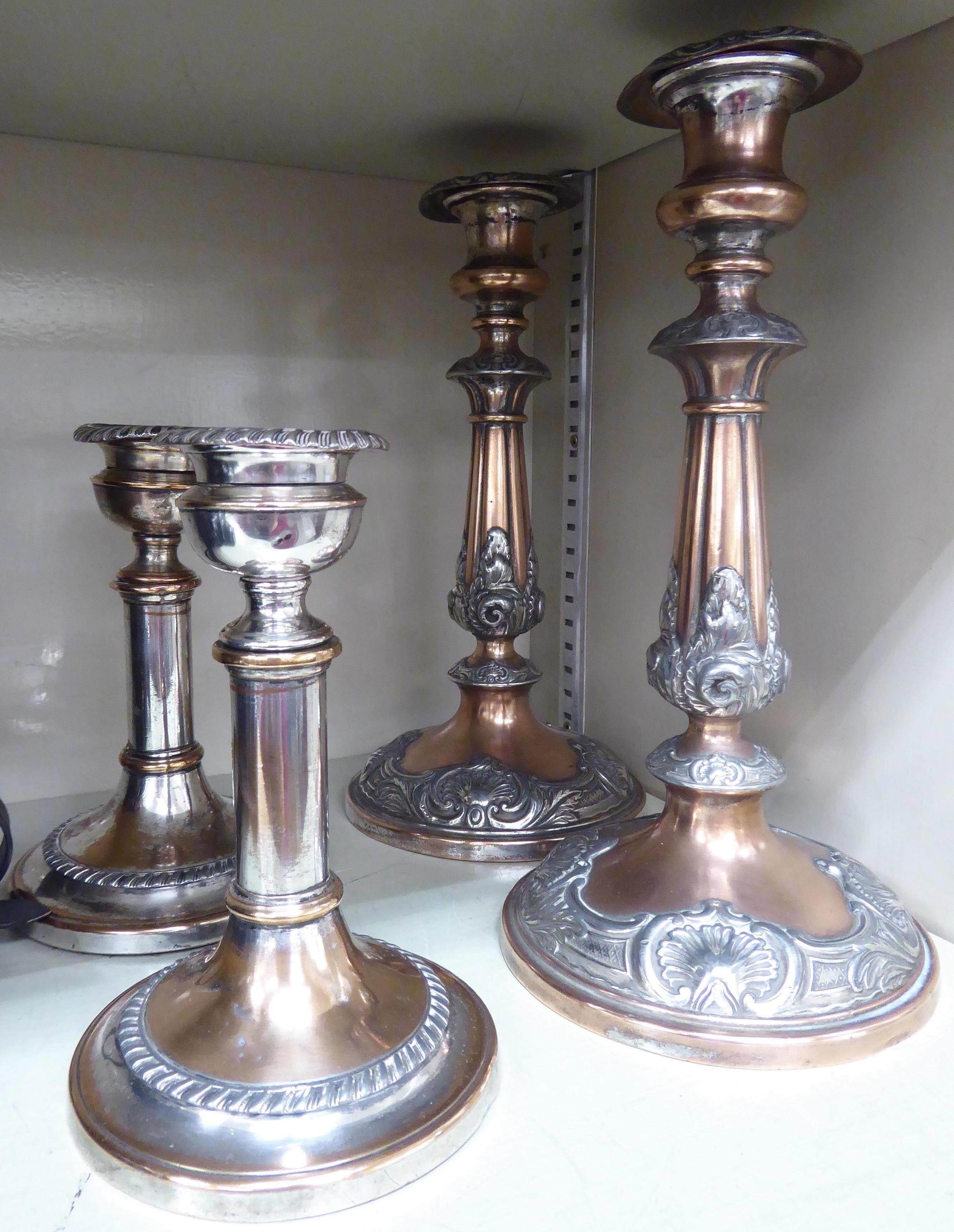 A pair of mid 19thC silver plated telescopic candlesticks with vase shaped sockets and gadrooned