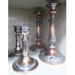 A pair of mid 19thC silver plated telescopic candlesticks with vase shaped sockets and gadrooned