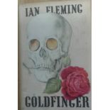 Fleming, Ian GOLDFINGER Cloth board with silver skull on front panel foxing on fep's and top of page