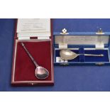 A silver reproduction wrythen spoon, London, in fitted case; and a Millennium seal top spoon,