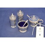 An Elizabeth II Lindisfarne pattern silver condiment set by Reid & Sons, Birmingham 1971,