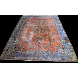 A Sarough carpet, with floral sprays on claret ground, 430 x 317cms.