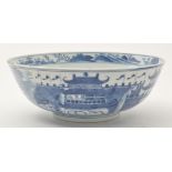 Chinese blue and white punch bowl, central recess with figure within lakeland landscape,