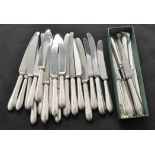 A set of ten Elizabeth II silver and steel bladed dinner knives and eleven dessert knives,