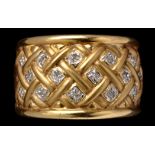 A diamond dress ring, set with eight cut diamonds in trellis work mount,