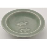 Chinese Celadon 'twin fish' dish, the interior moulded with twin fish,