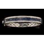 A sapphire and diamond bangle,