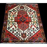 A nomadic Persian rug, with simple floral design, 138 x 103cms.