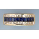 A sapphire and diamond dress ring, set with a single row of ten square facet cut sapphires,