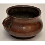 Chinese cast bronze censer, of bombé from with everted rim above loop handles, on splay foot ring,