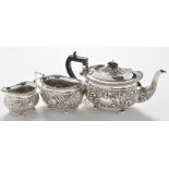 A Victorian three piece silver tea service, by Joseph Gloster Ltd.