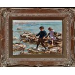 William Marshall Brown, RSA, RSW (1863-1936) A girl and boy gathering shellfish on a rocky shore,