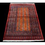 A Bokhara rug, with three rows of nineteen teke medallions surrounded by multiple border,