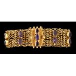 A Victorian amethyst and yellow metal bracelet,