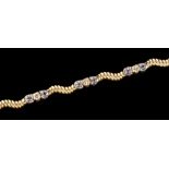 A tanzanite, diamond, and yellow metal bracelet,