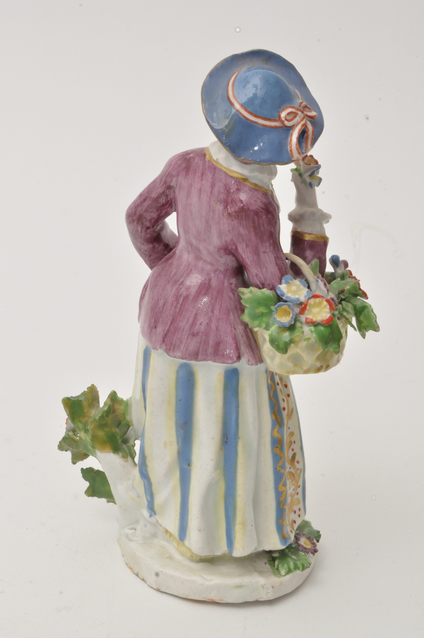 Bow figure of a flower girl, standing holding a basket of flowers over her right arm, - Image 5 of 12